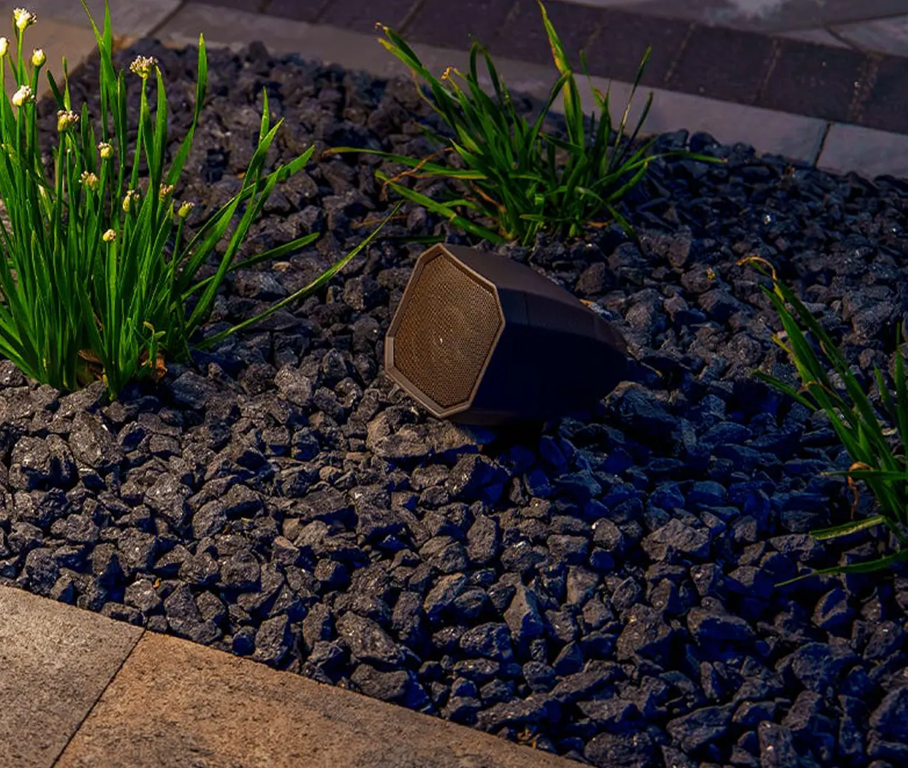 Outdoor Landscape Speaker among decorative garden stones